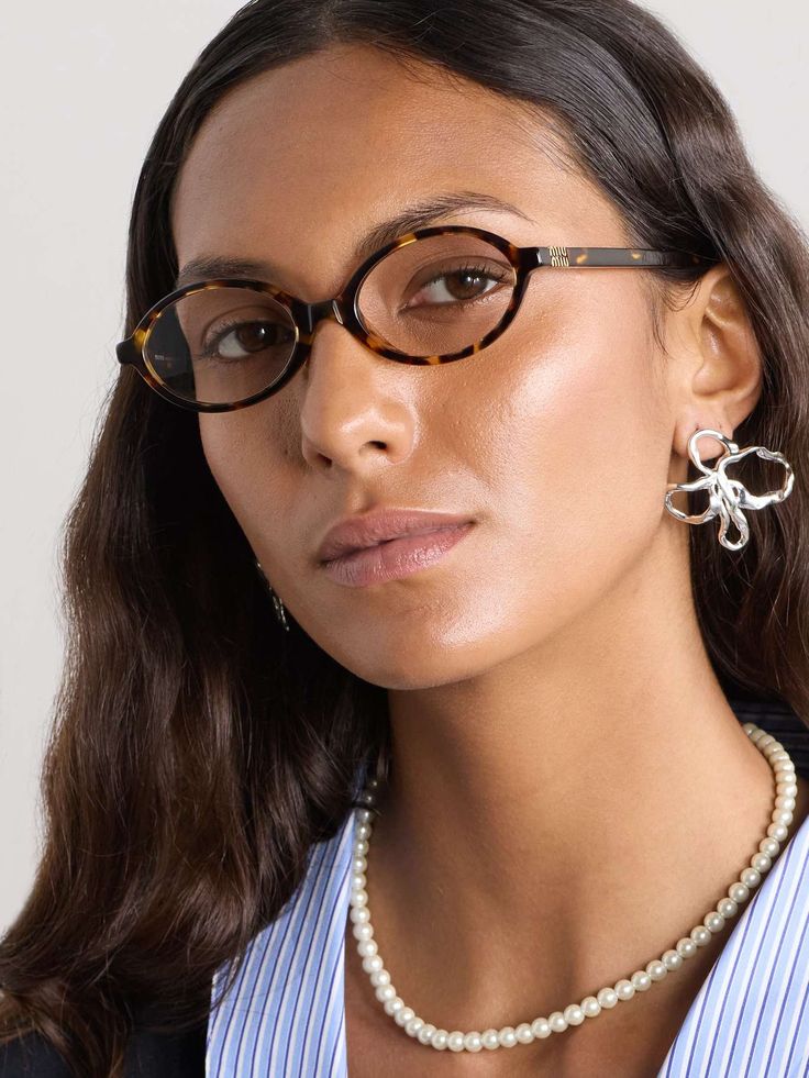 Model wearing Miu Miu eyeglasses