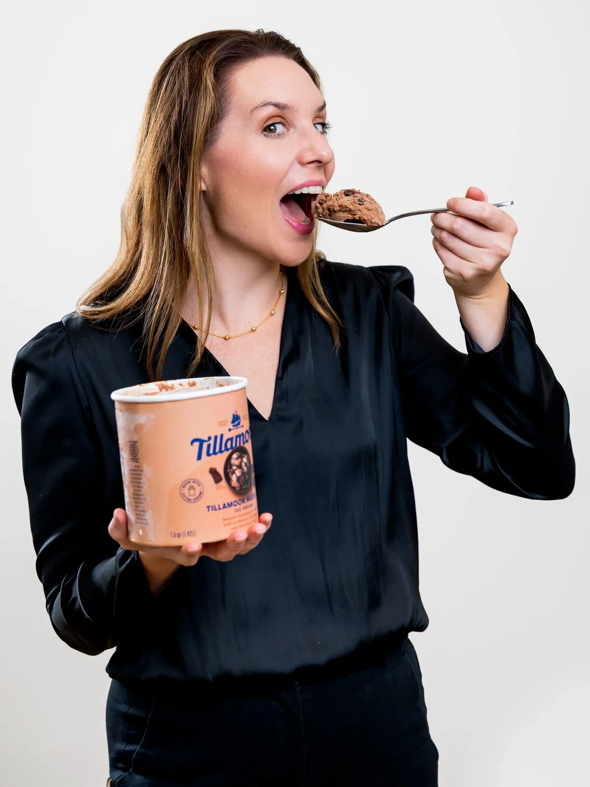 Dr. Ashlin Naquin taking a spoonful of Tillamook chocolate ice cream