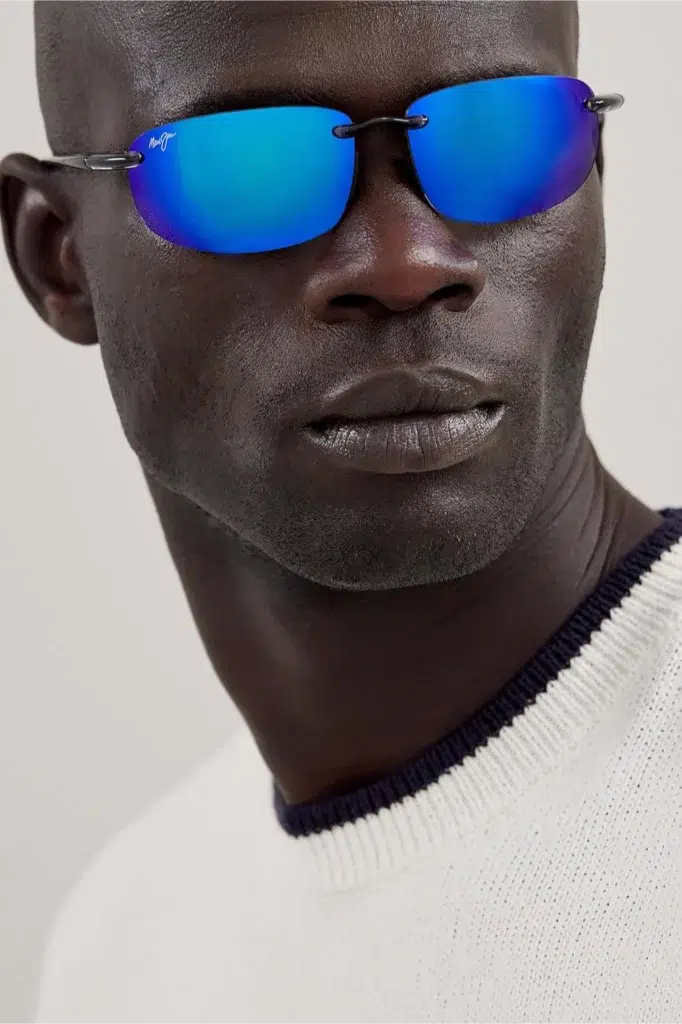 Man wearing blue mirrored Maui Jim sunglasses