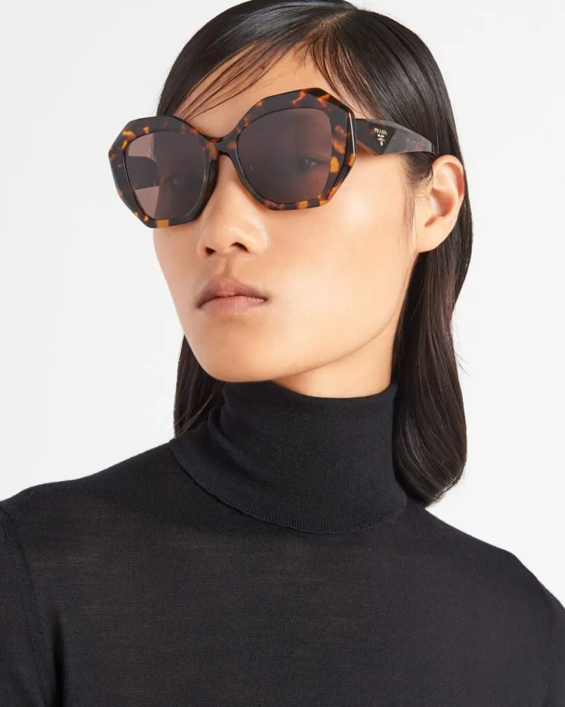 Woman wearing oversized tortoiseshell Prada sunglasses