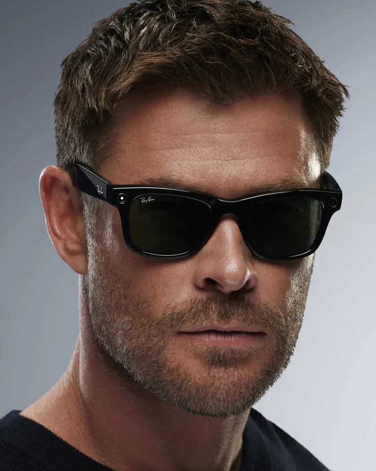 Man wearing classic black Ray-Ban sunglasses