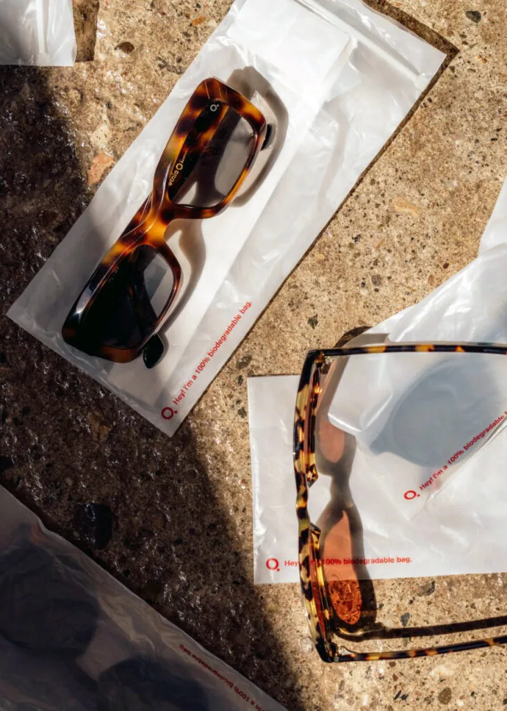 Etnia Barcelona tortoiseshell frames resting on their cases on a stone surface