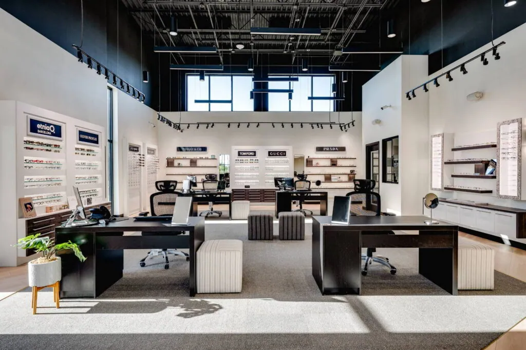 The Village Vision Center optical showroom, with designer frame walls and fitting desks